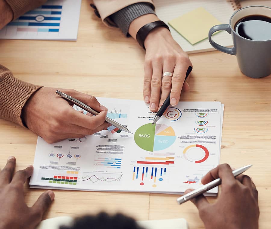 People Discussing Charts and Graphs seo services